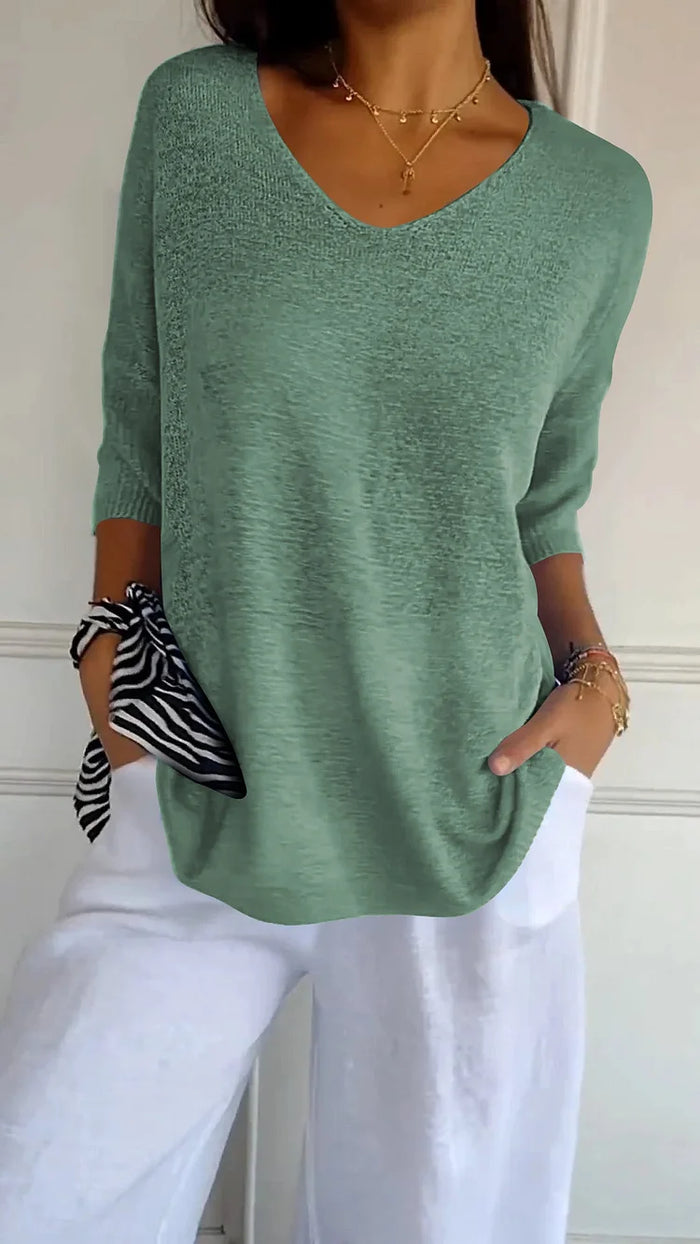 CM | Cómoda blusa con escote en V y corte holgado. Blusa informal y holgada con mangas de longitud media.