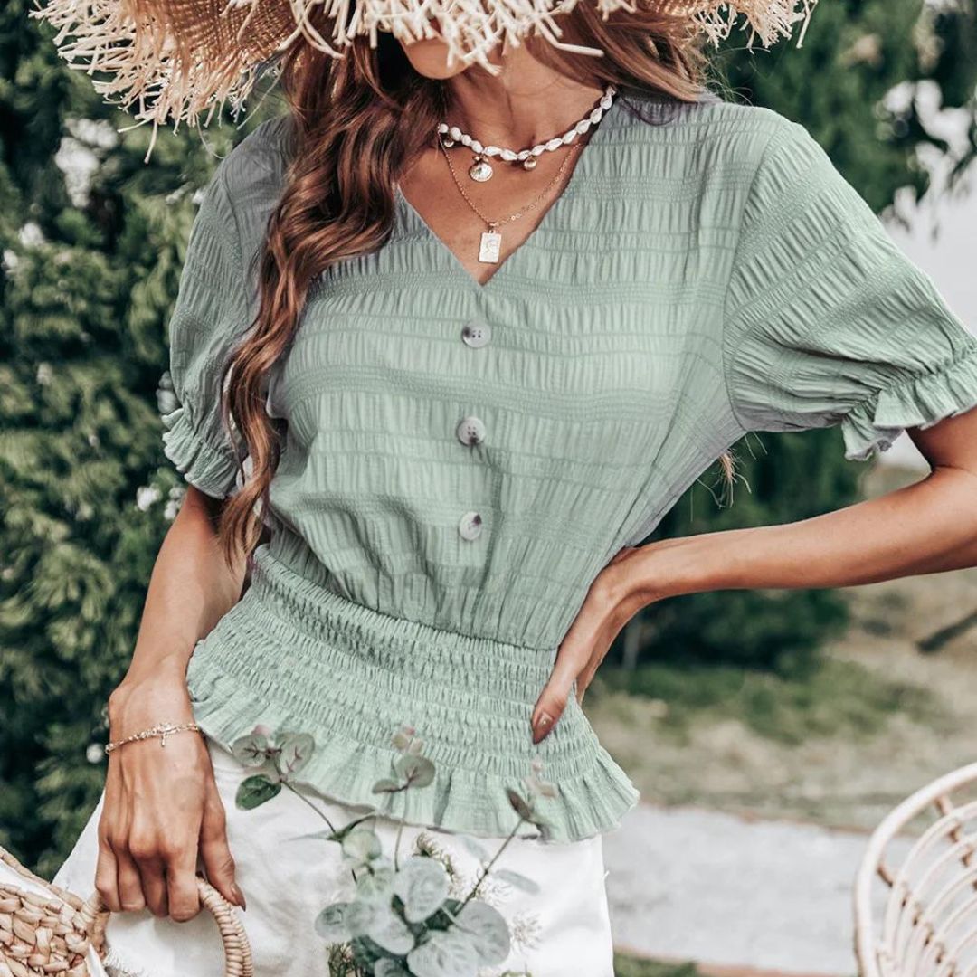 CM | Blusa con cierre de botones y peplum