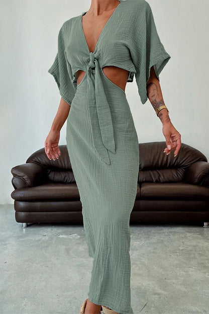 CM | Vestido largo con recortes y nudo central