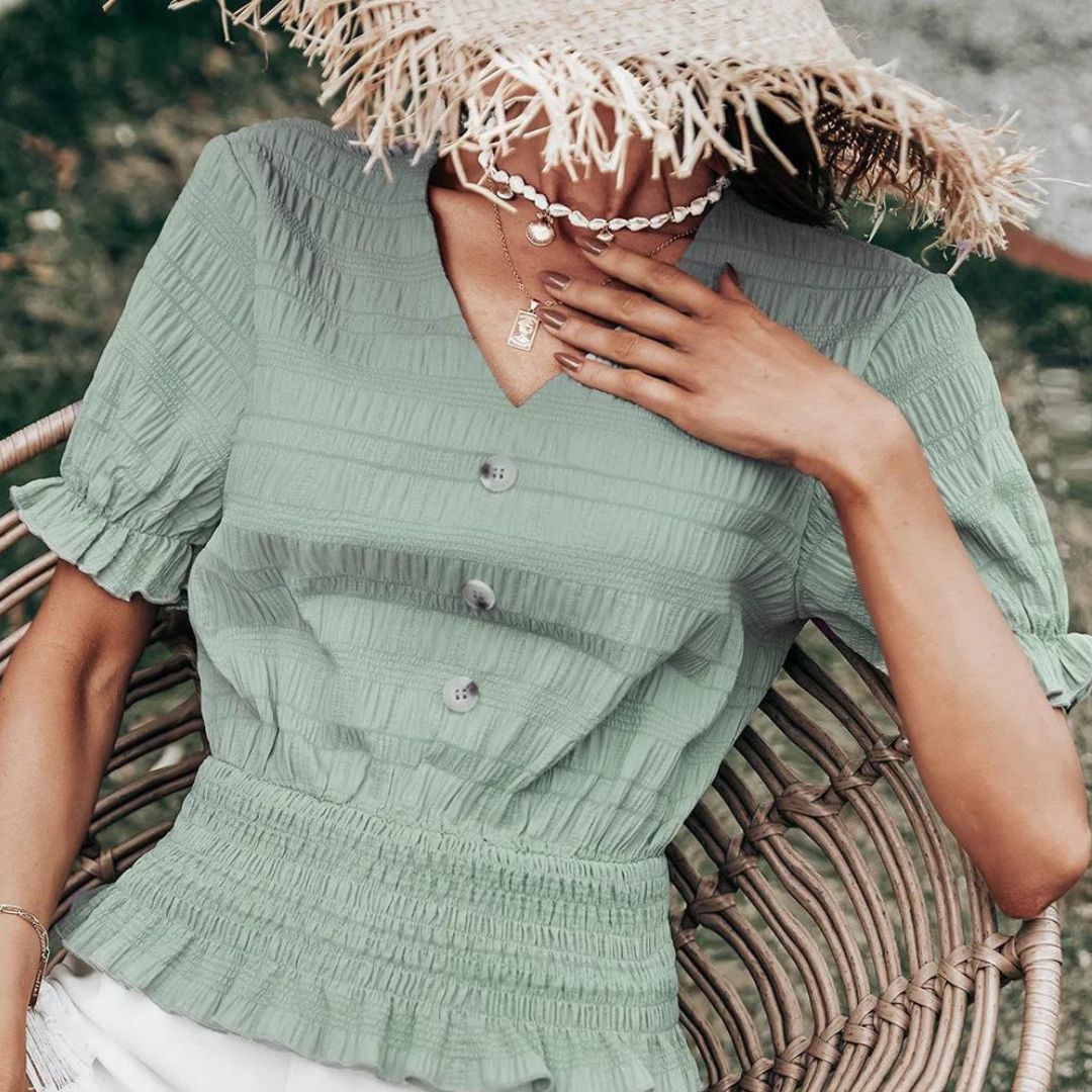 CM | Blusa con cierre de botones y peplum