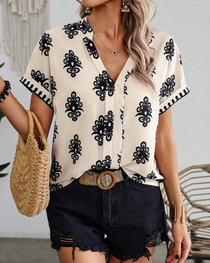 CM | Elegante blusa estampada con escote en V y manga corta