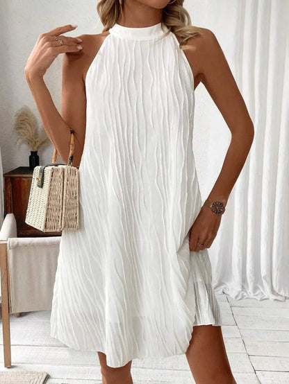 CM | Cautivador mini vestido sin mangas y espalda