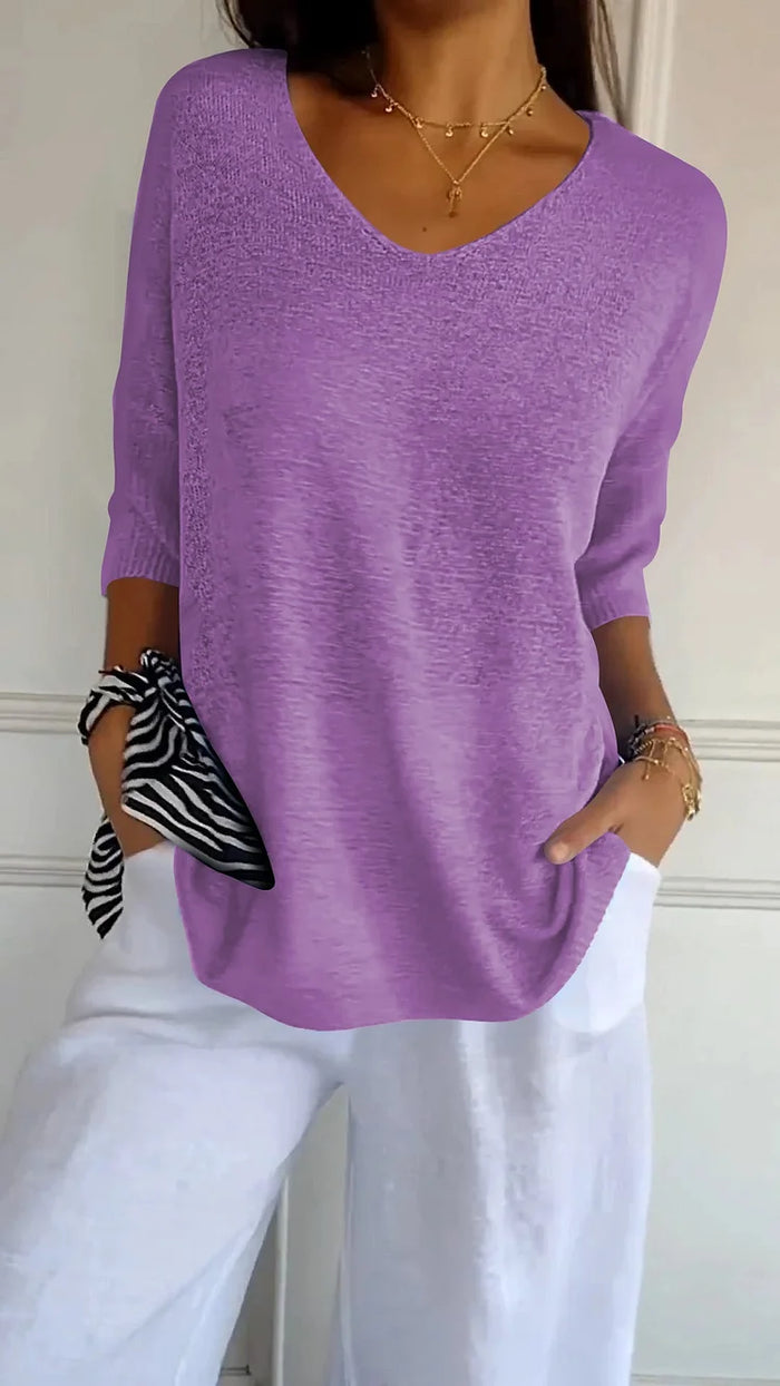 CM | Cómoda blusa con escote en V y corte holgado. Blusa informal y holgada con mangas de longitud media.