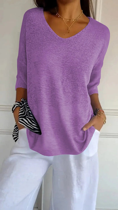 CM | Cómoda blusa con escote en V y corte holgado. Blusa informal y holgada con mangas de longitud media.
