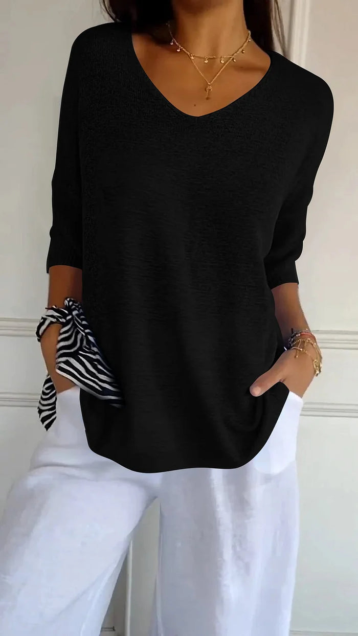 CM | Cómoda blusa con escote en V y corte holgado. Blusa informal y holgada con mangas de longitud media.