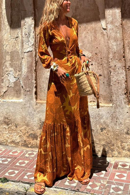 CM | Vestido maxi de manga larga con escote en pico y estampado de girasoles