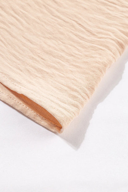 CM | Vestido cruzado en color avena con corpiño sin espalda y maxi vestido con capas