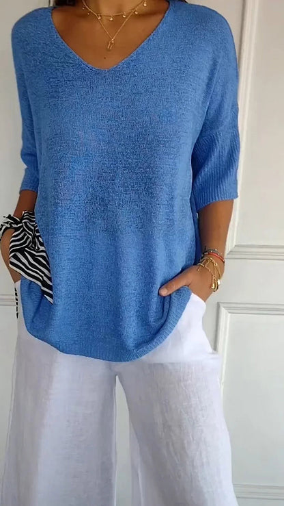 CM | Cómoda blusa con escote en V y corte holgado. Blusa informal y holgada con mangas de longitud media.