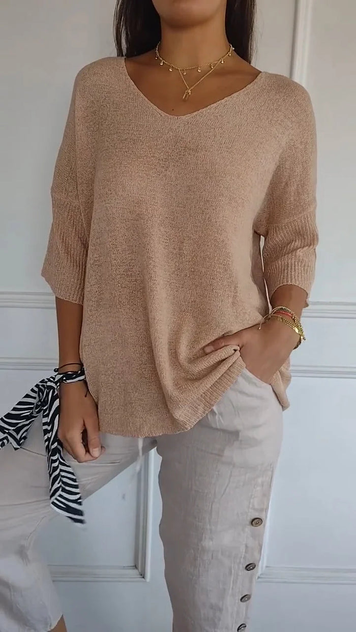 CM | Cómoda blusa con escote en V y corte holgado. Blusa informal y holgada con mangas de longitud media.