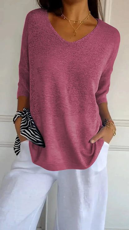 CM | Cómoda blusa con escote en V y corte holgado. Blusa informal y holgada con mangas de longitud media.