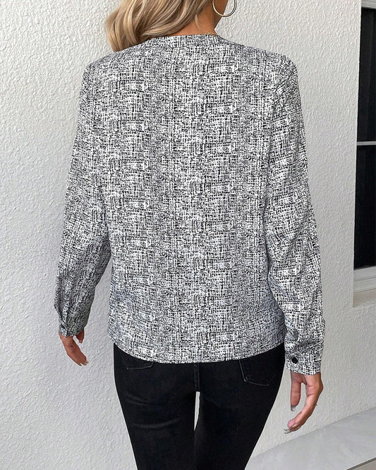 CM | Elegante blusa estampada de manga larga con escote en V